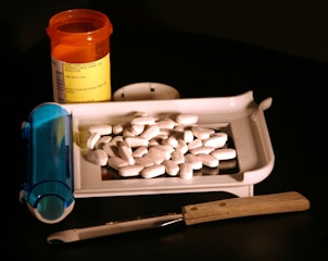 a white container with a white substance and a blue container with a white substance in it