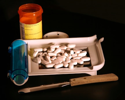 a white container with a white substance and a blue container with a white substance in it