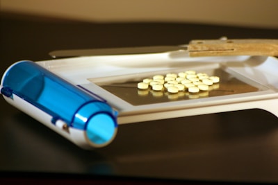 a close-up of a syringe and pills