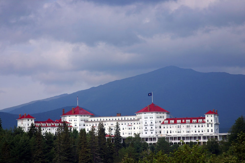 a large white building with red roofs