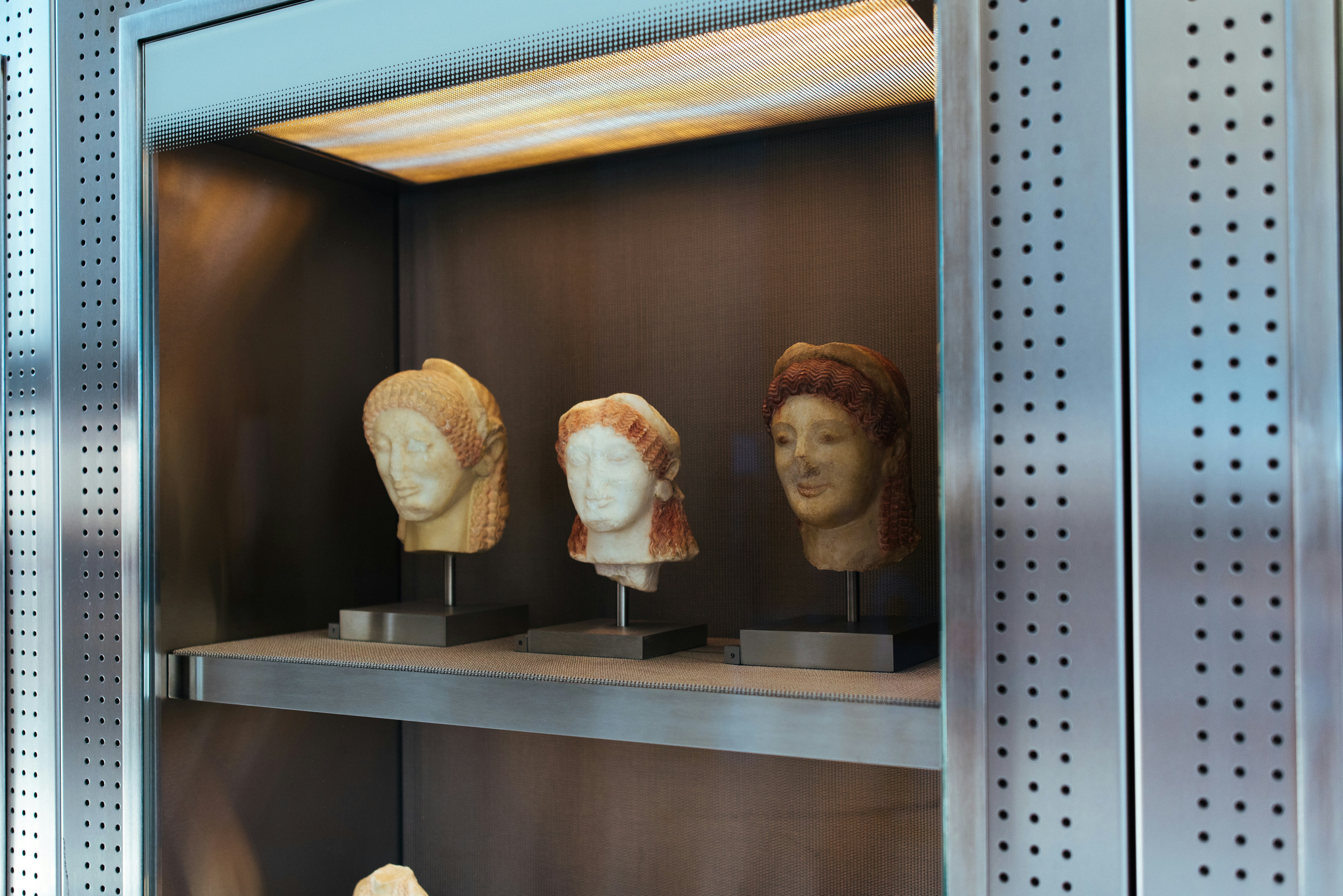 a couple of heads on a shelf
