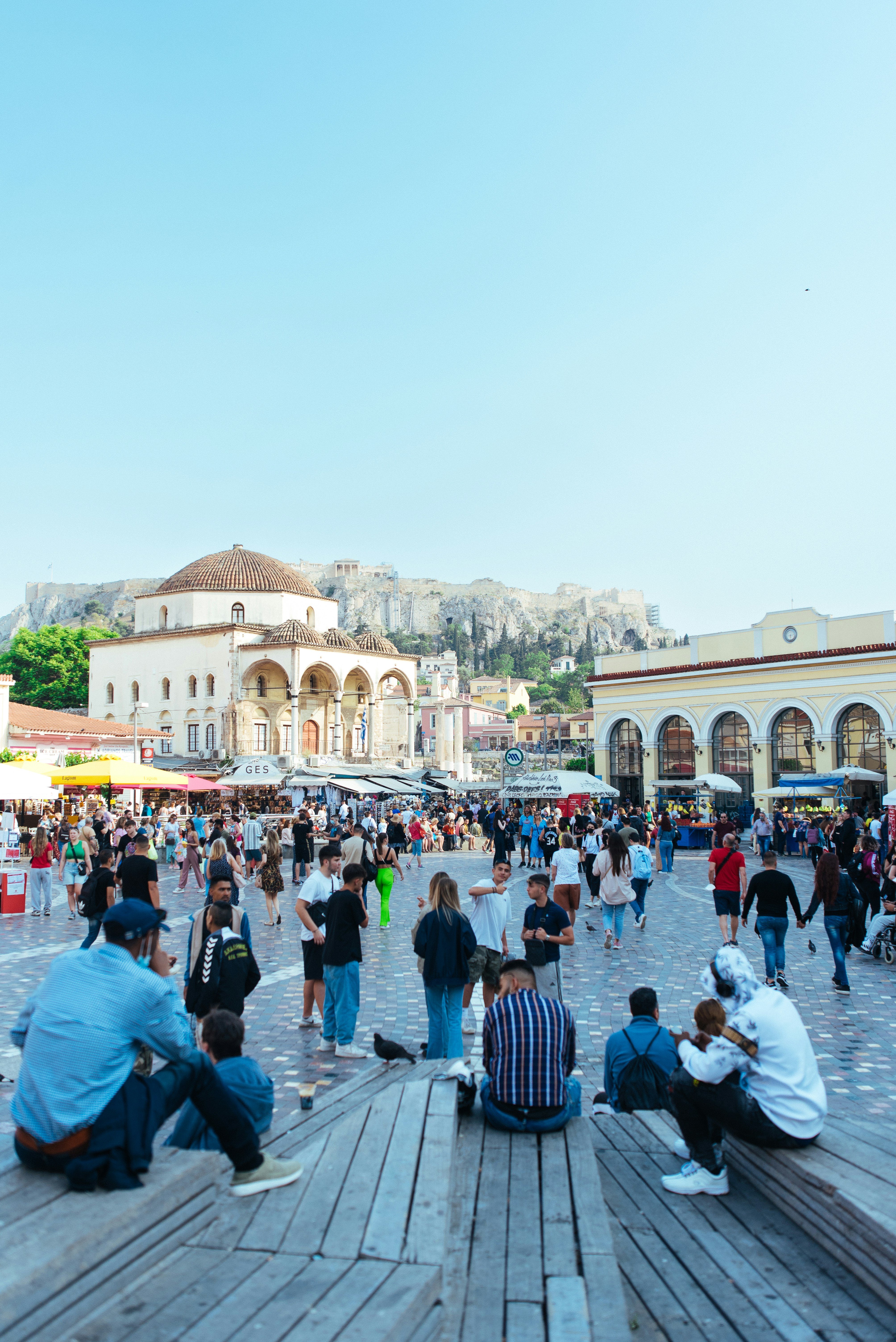 a group of people in a plaza