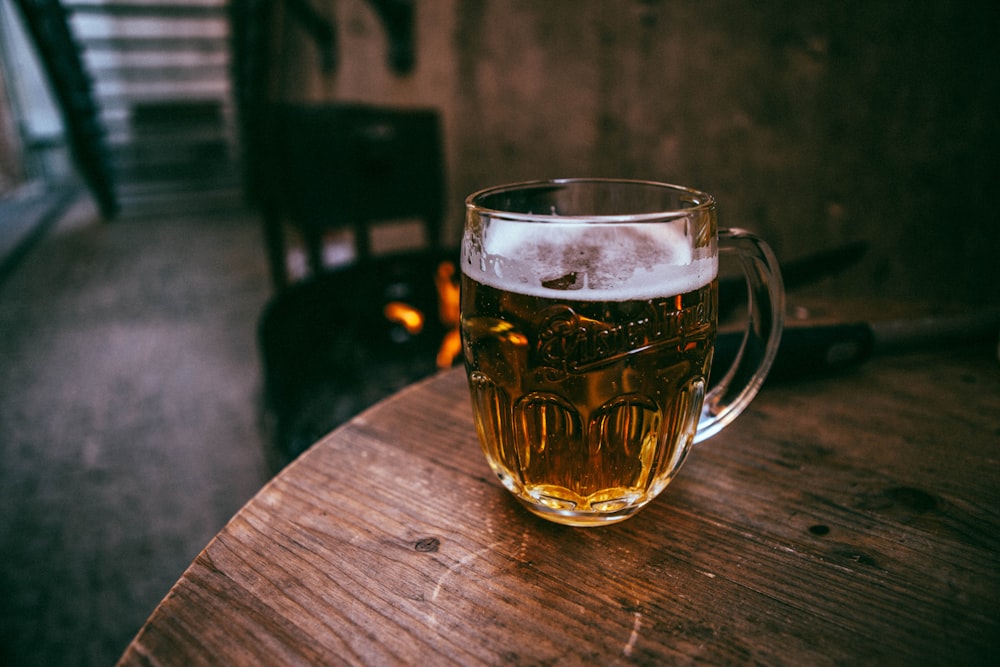 a glass of beer on a table