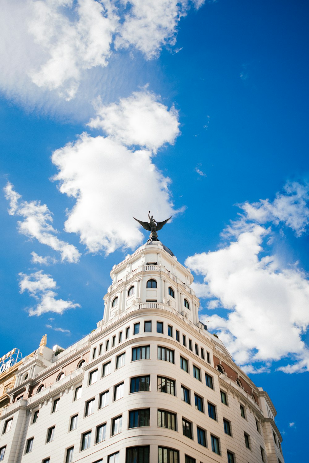 a tall building with a blue sky