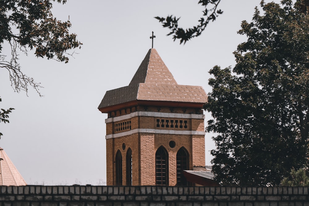 a brick building with a cross on top