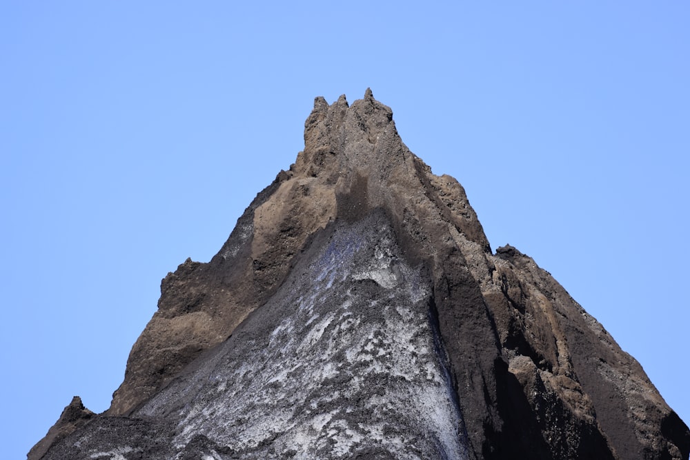 a mountain with a blue sky