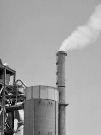 a factory with smoke stacks