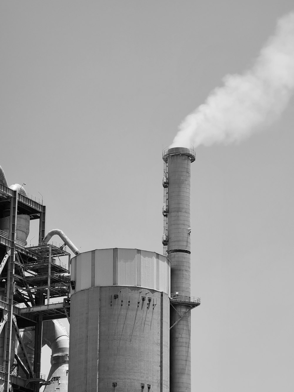 a factory with smoke stacks