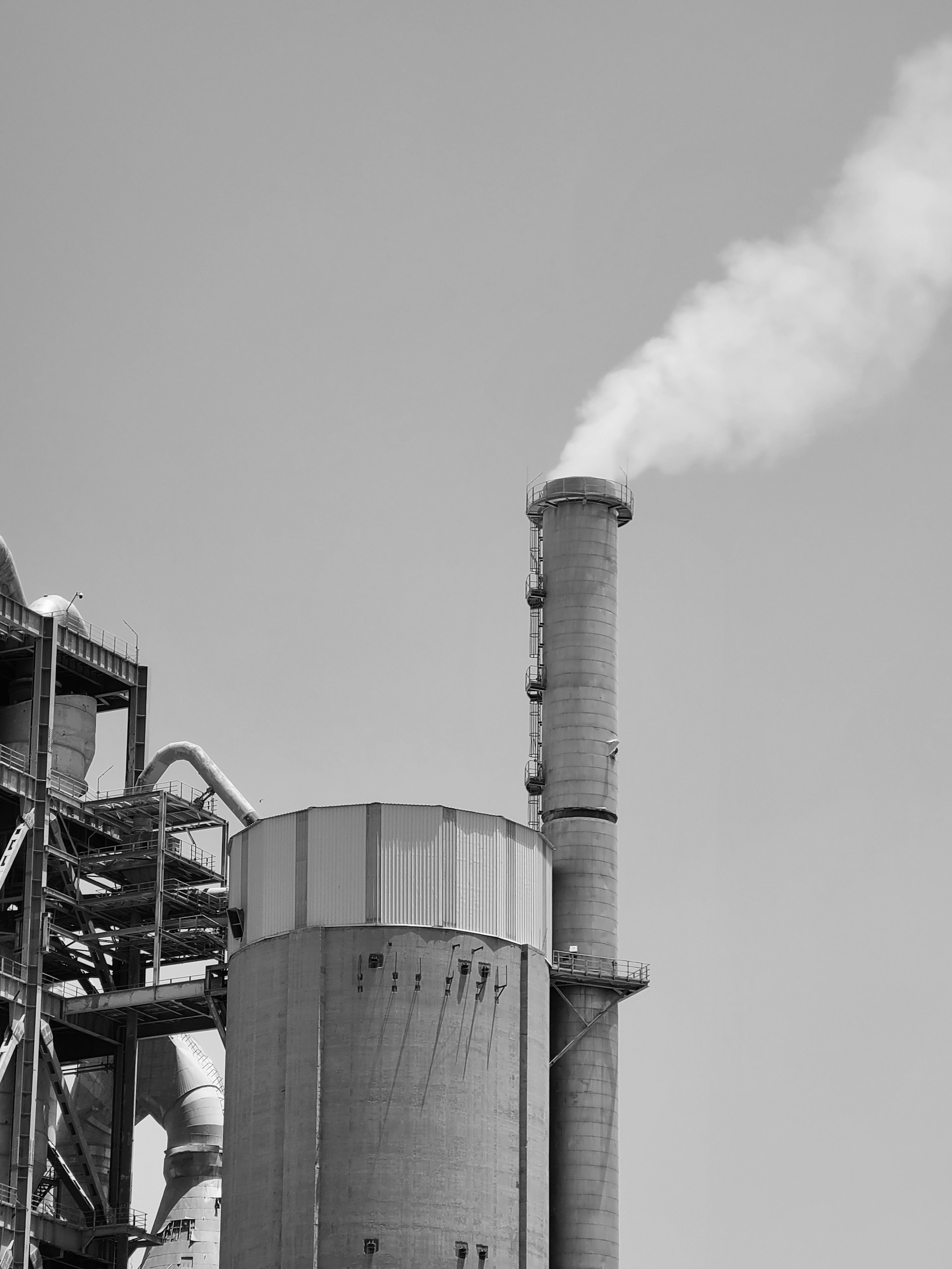 a factory with smoke stacks