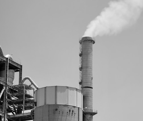 a factory with smoke stacks