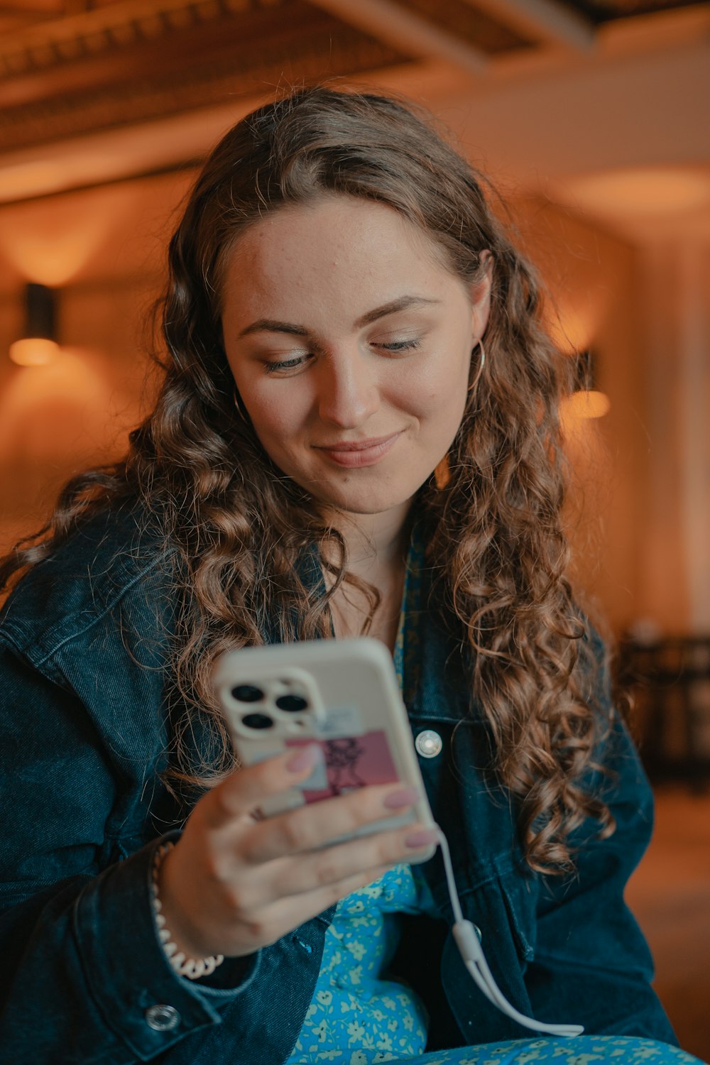 a woman holding a phone