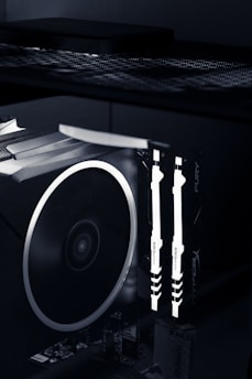 Image showing RAM sticks next to a graphics card inside a gaming PC.