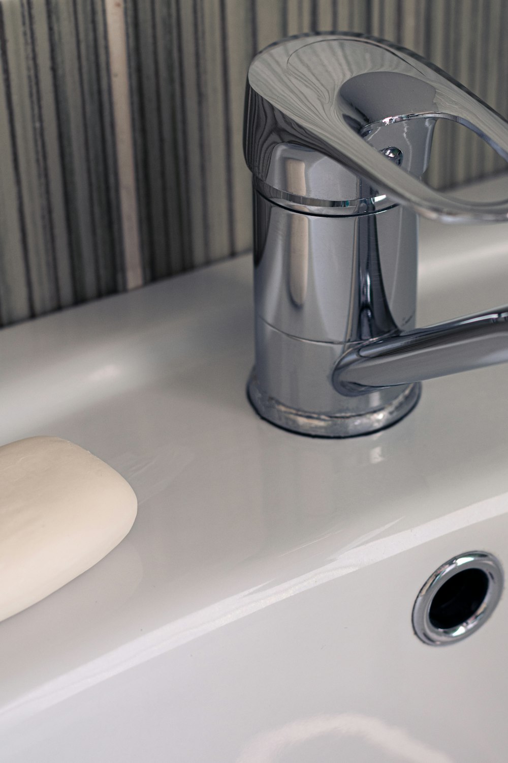 a sink with a soap dispenser