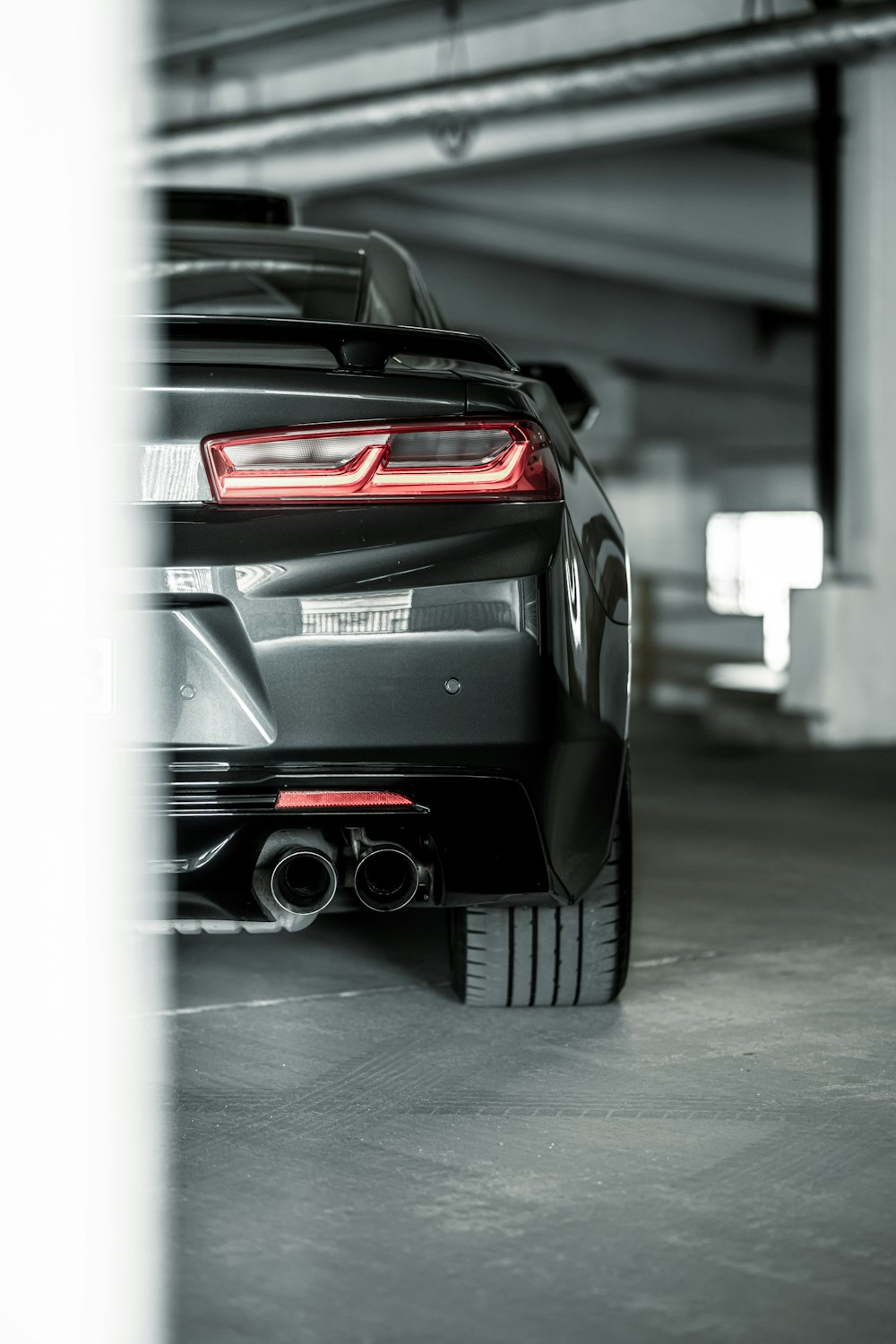 a black car parked in a garage