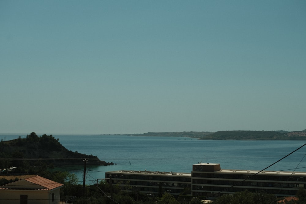 a body of water with buildings and trees around it