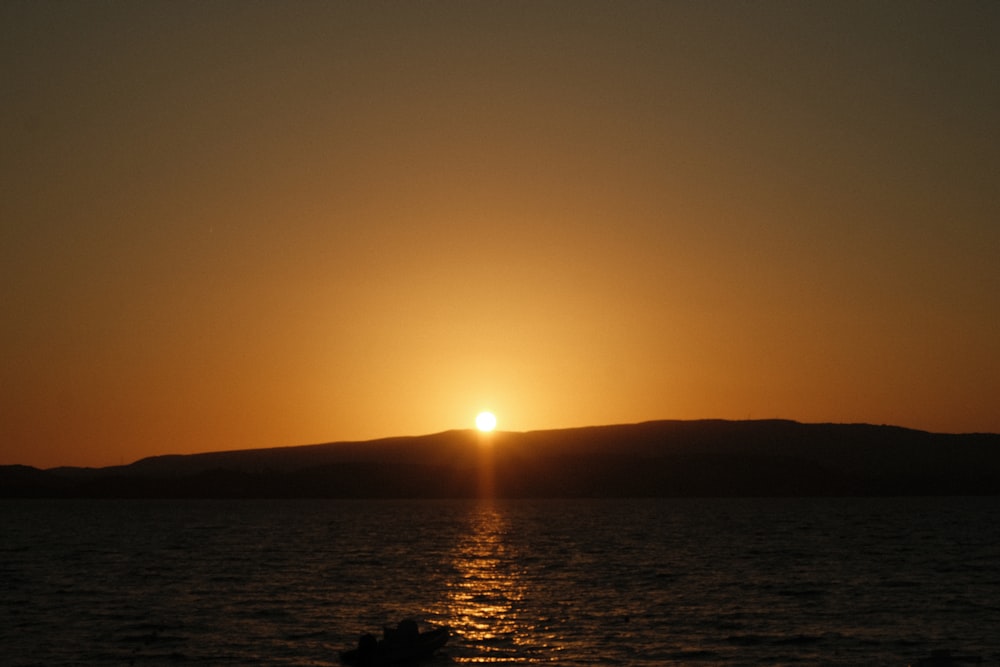 a sunset over a body of water