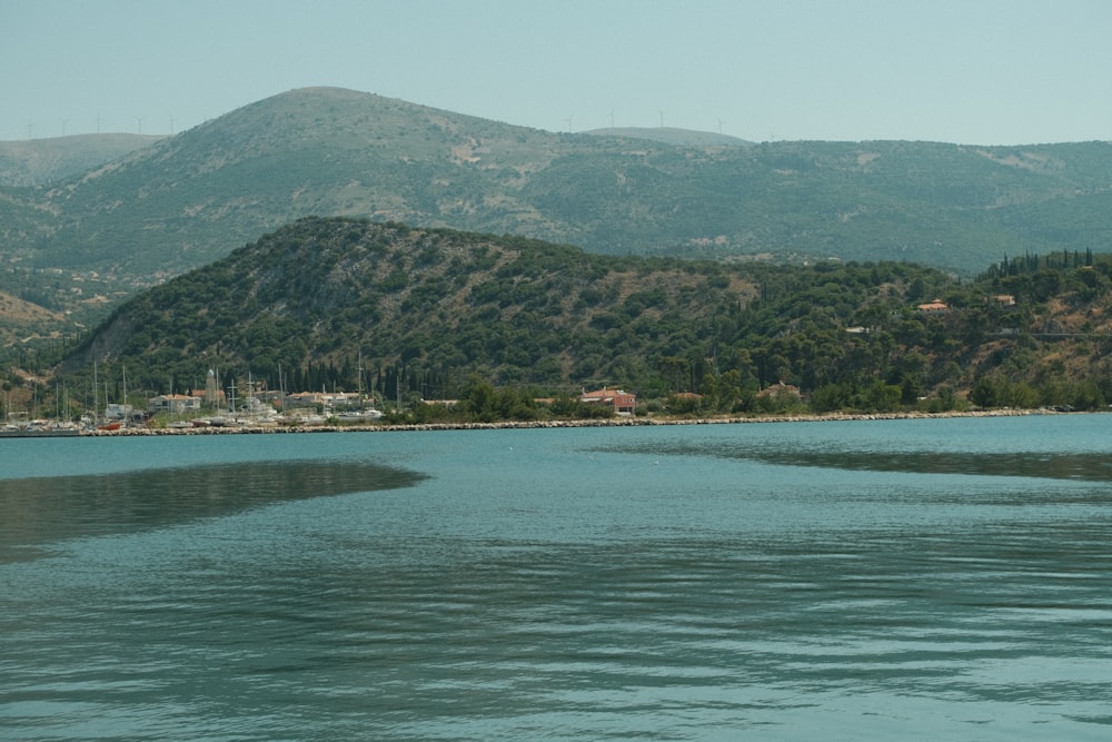 a body of water with a town in the distance