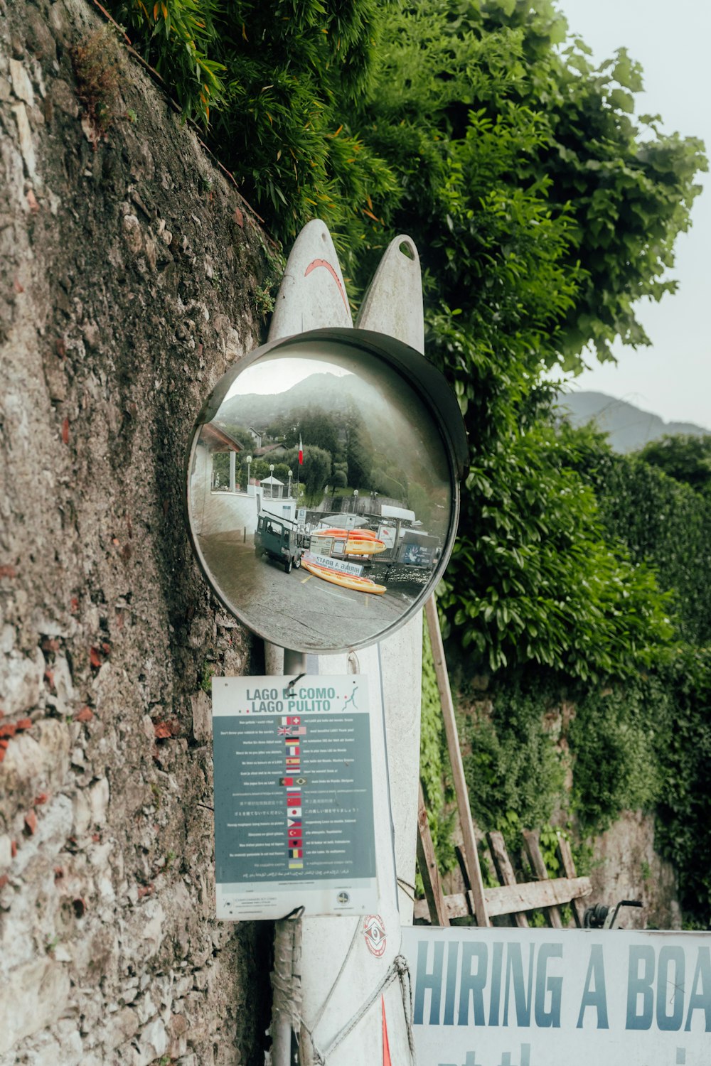 a mirror showing a street