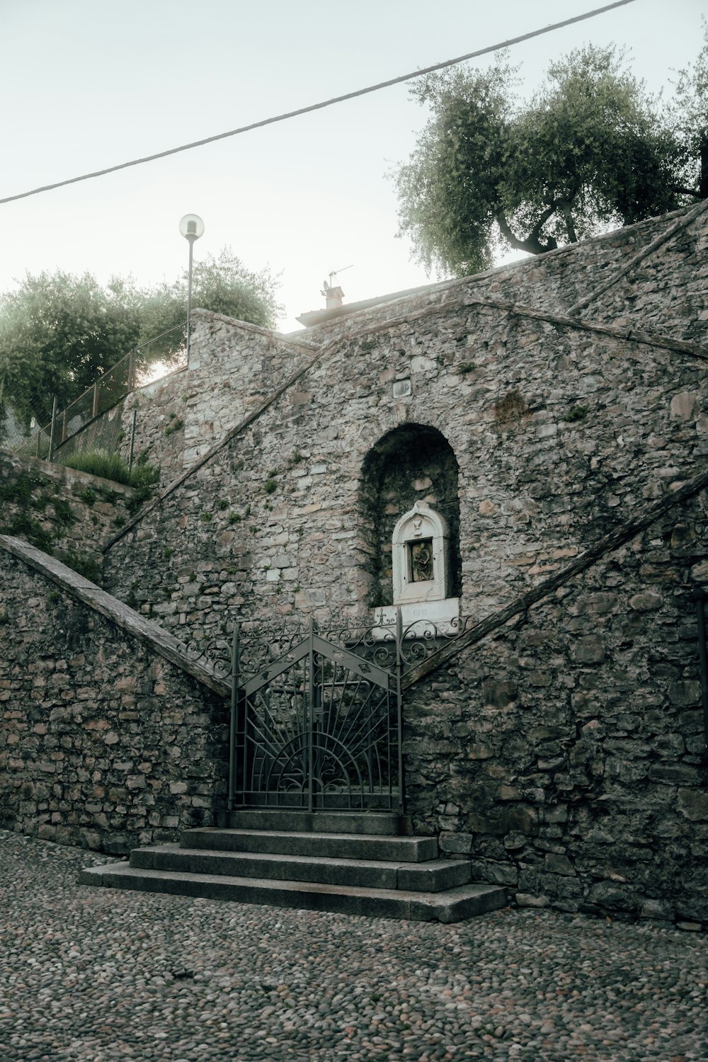 a stone wall with a door and a window