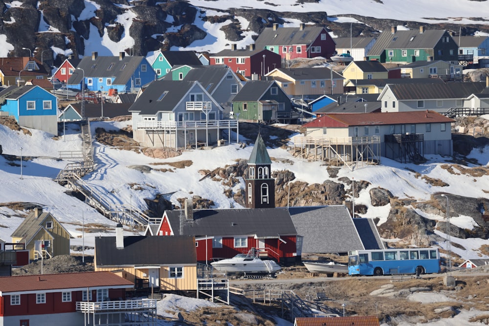 a group of buildings with snow on the roofs