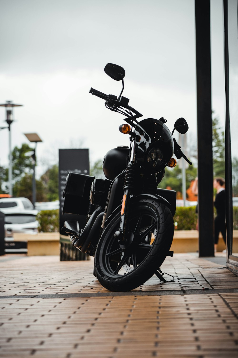 a motorcycle parked on a sidewalk