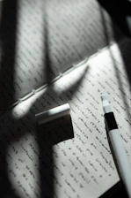 a pen on a piece of paper