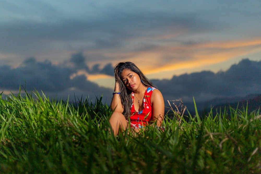 a person sitting in a grassy field