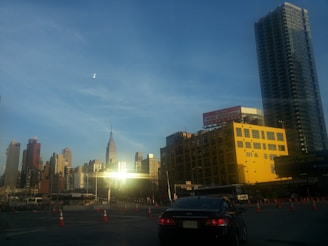 Wide shot of the mini storage building exterior near busy city streets