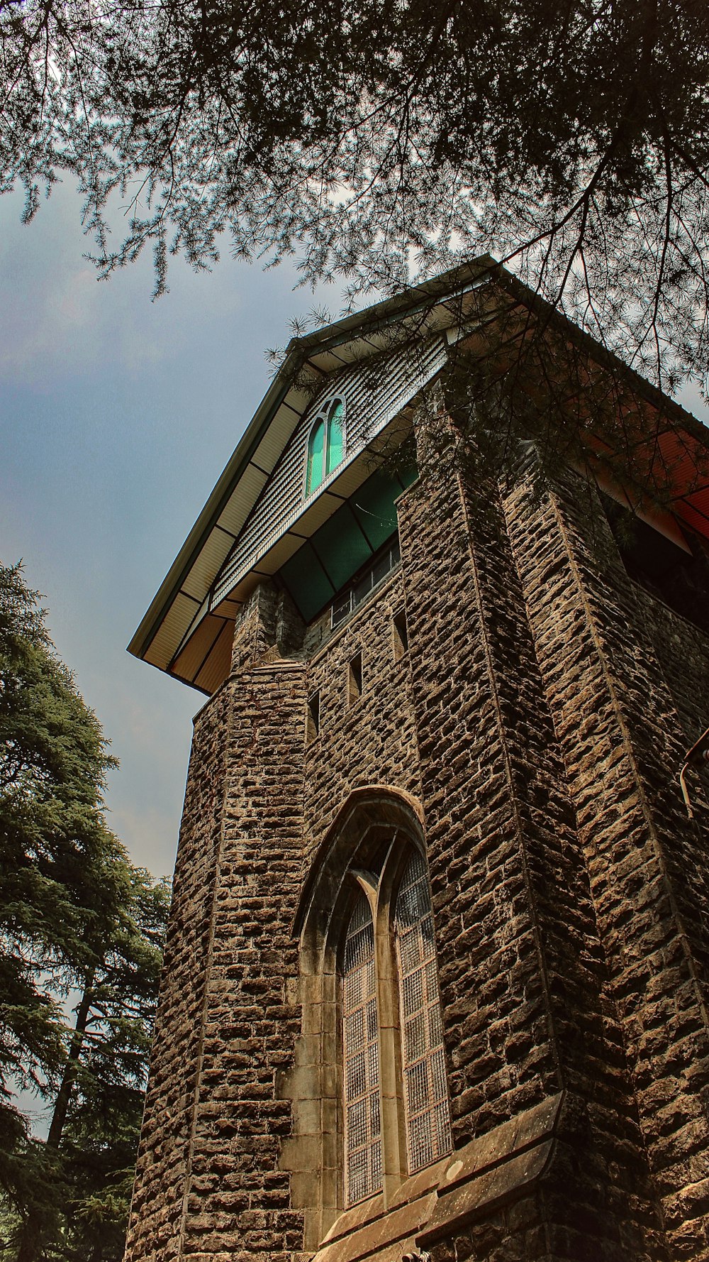 a brick building with a green roof