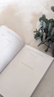 Muted olive and cream printable planner spread with nature-inspired icons and clean layout