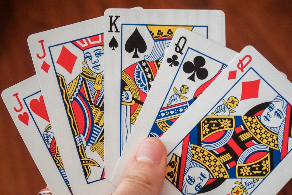 a hand holding a game card