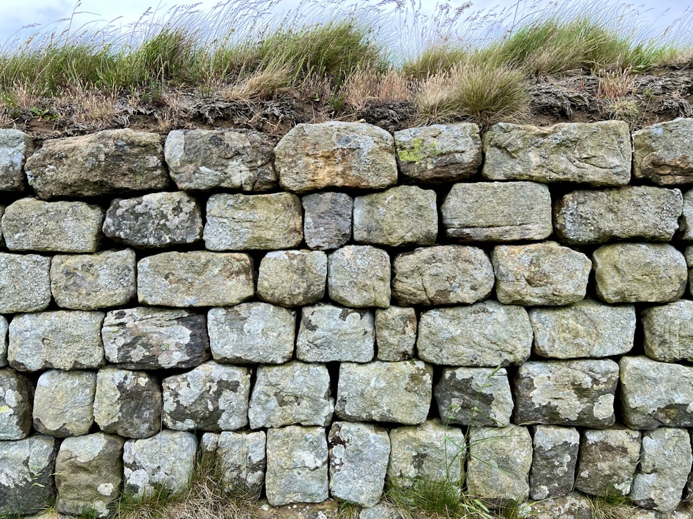 a stone wall with a stone fence
