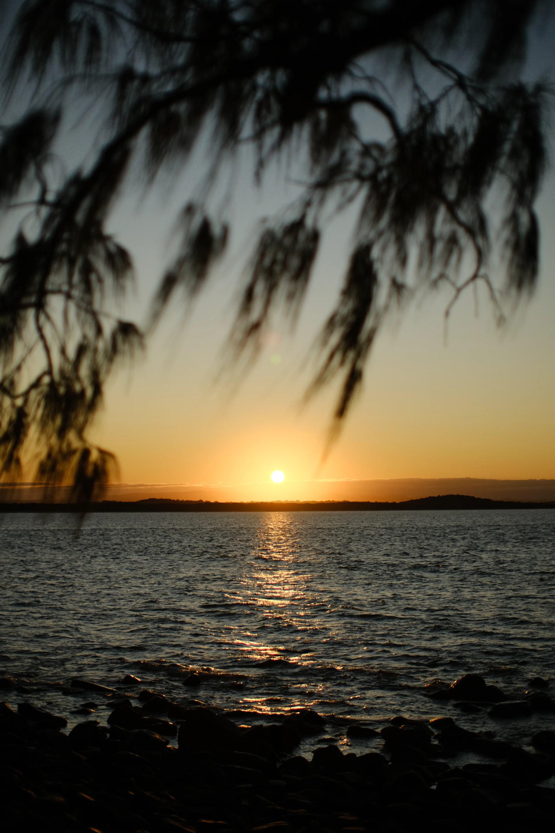 a sunset over a body of water