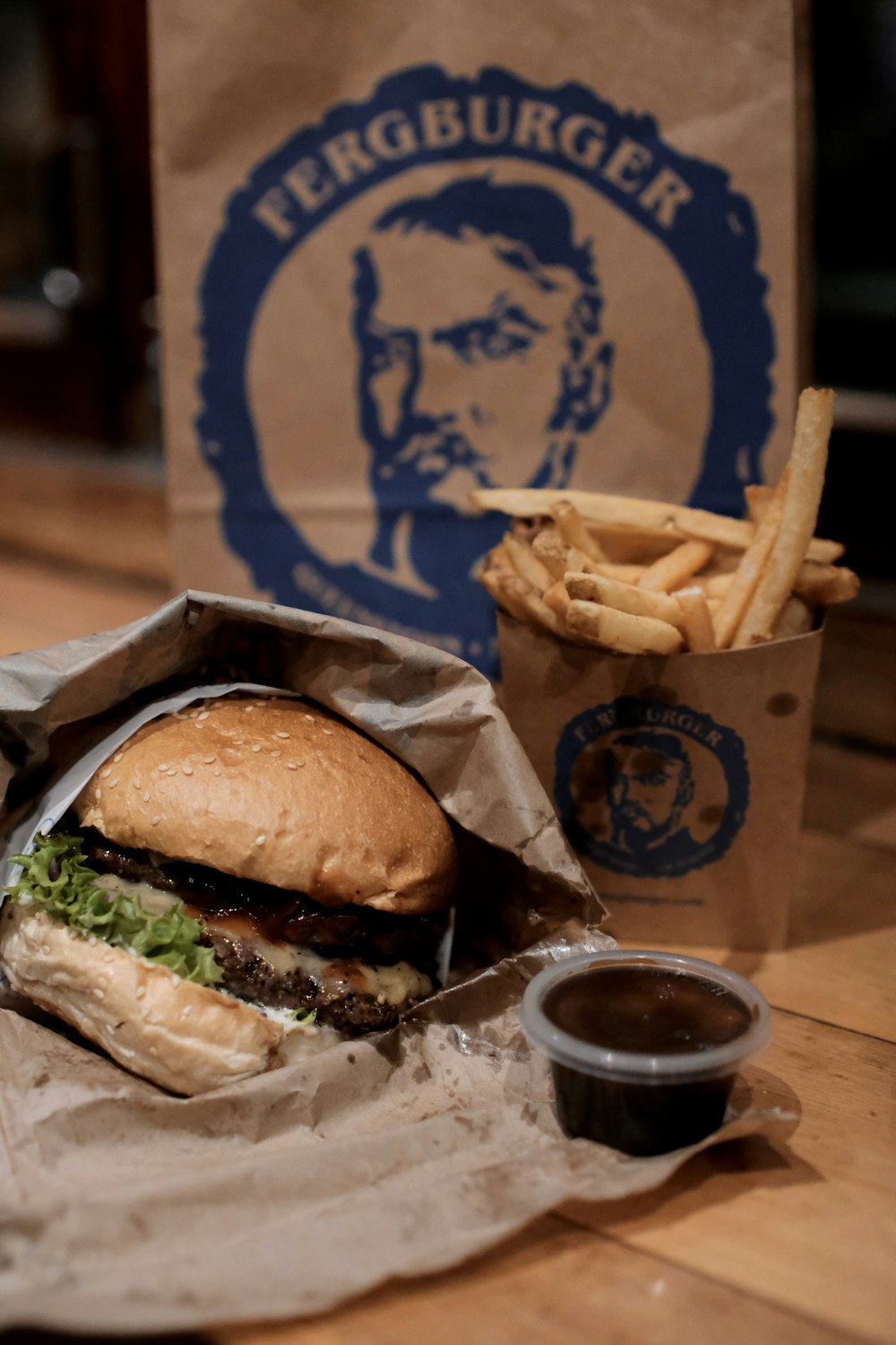 a burger and fries on a table