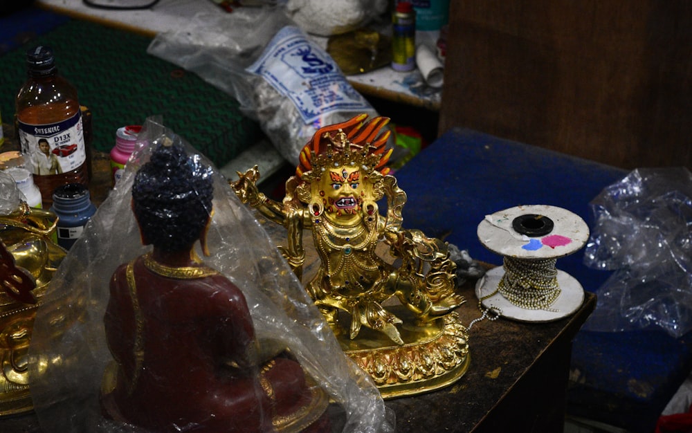 a gold statue on a table