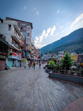 The bustling main street of Pigeon Forge with colorful shops and mountain views.