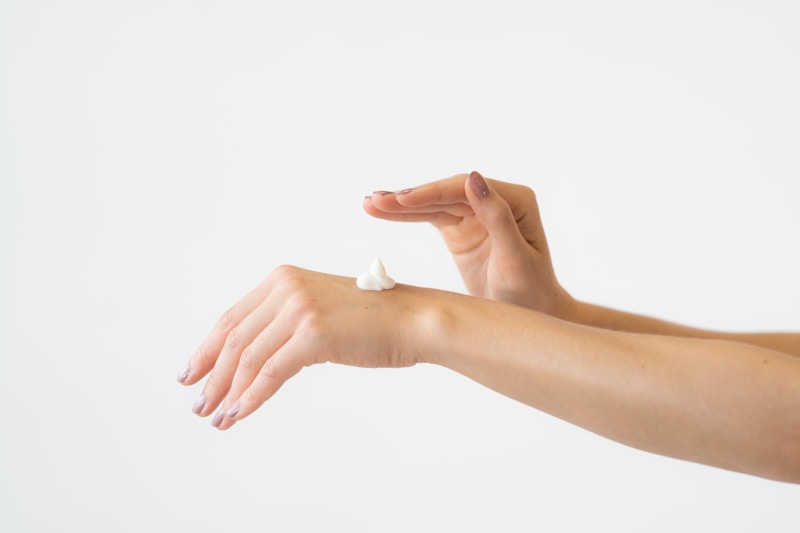 Applying a skincare serum by hand