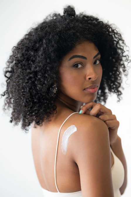 Lady applying natural Body Butter to her skin