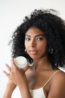 a woman holding a cup