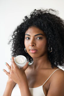 a woman holding a cup