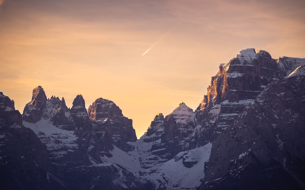 a rocky mountain with snow