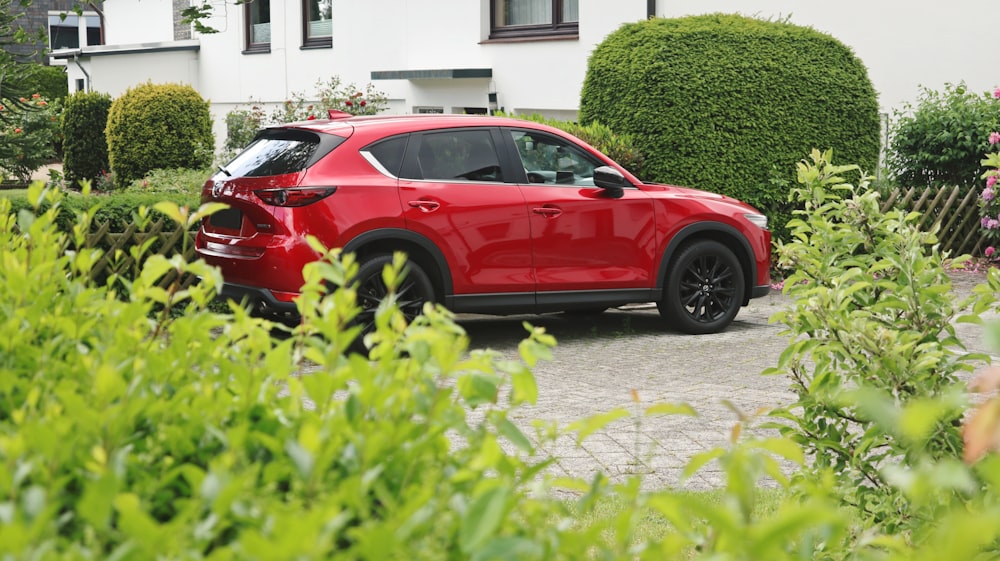 a red car parked in a driveway