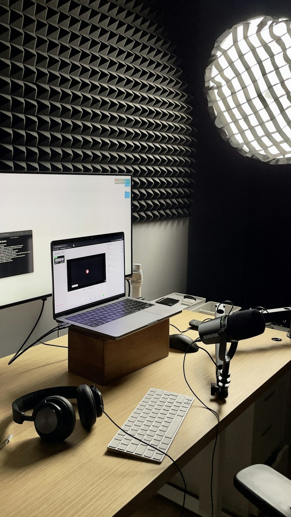 a laptop and headphones on a desk