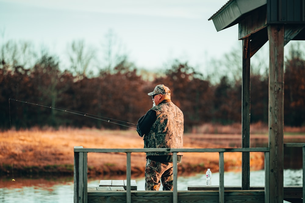 a person fishing on a pier