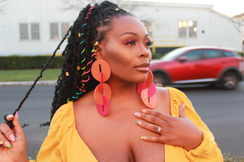 happy curvy single in yellow shirt celebrating