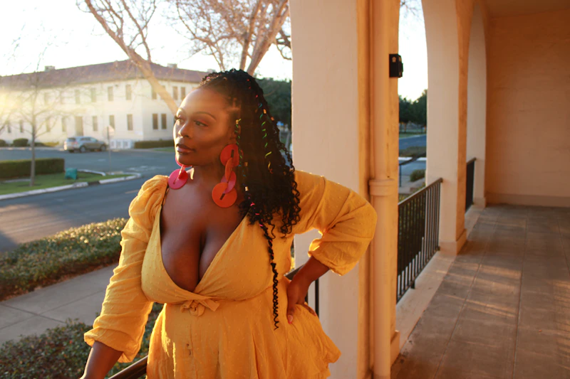 Vibrant BBW woman in a yellow dress