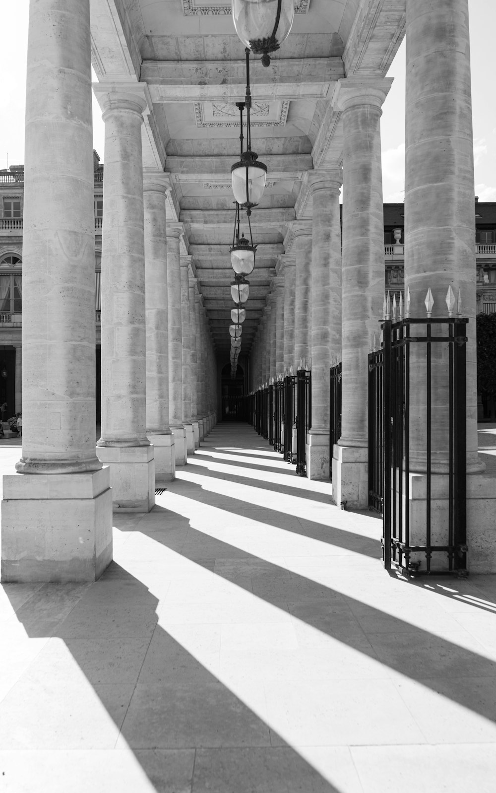 a walkway with pillars