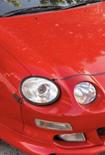 A close-up of a car with a protective shield overlay.