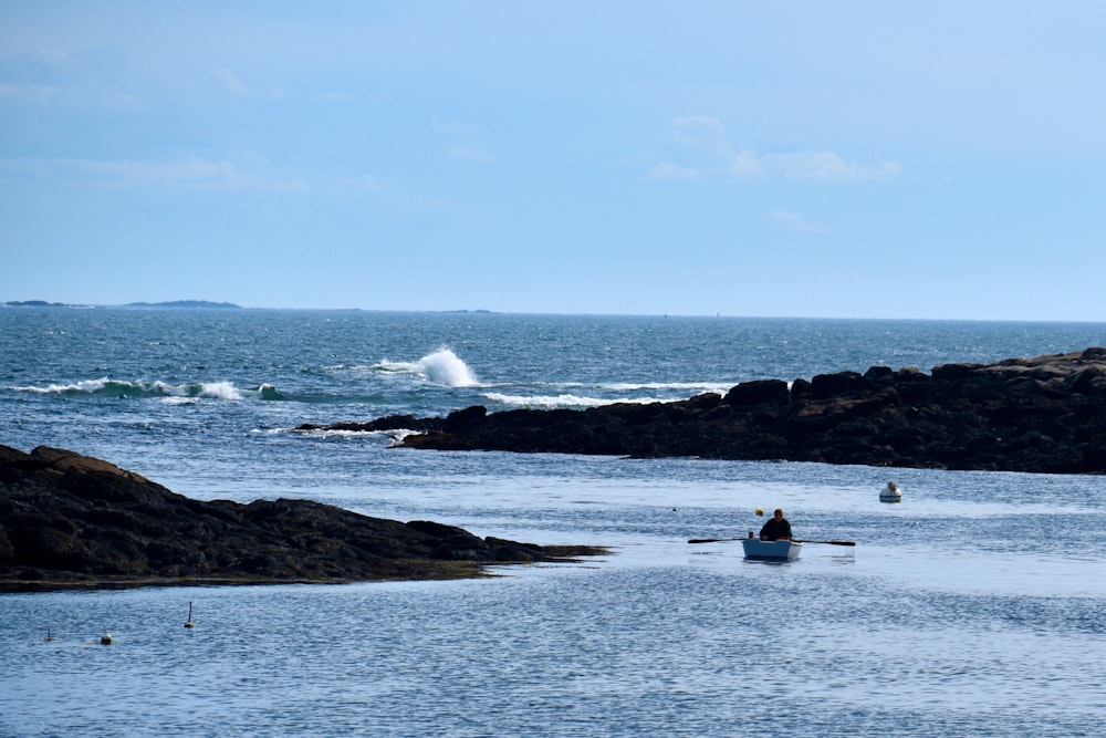 a person in a boat in the ocean