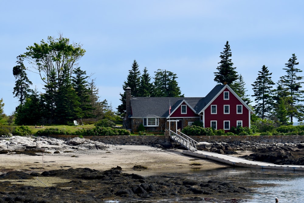 a red house by the water